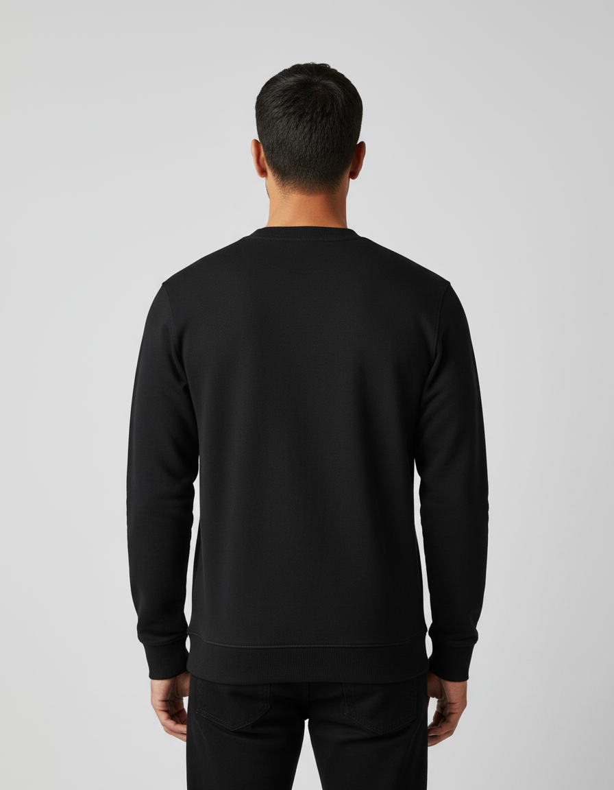 Rear view of man wearing plain black sweatshirt and black pants on gray background