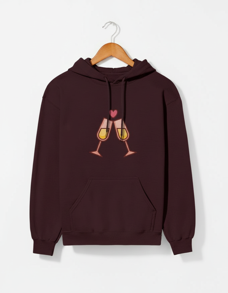 Dark maroon hoodie with clinking champagne glasses and a pink heart graphic on front
