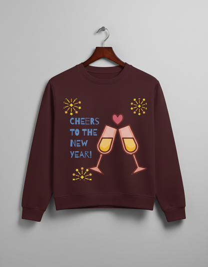 Maroon sweatshirt with New Year design showing two clinking champagne glasses, blue text, and yellow fireworks